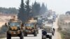 A Turkish military convoy is seen moving through eastern Idlib province, Syria, Feb. 28, 2020, a day after 33 Turkish soldiers were killed in the province in an airstike by Syrian government forces.