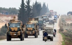 A Turkish military convoy is seen moving through eastern Idlib province, Syria, Feb. 28, 2020, a day after 33 Turkish soldiers were killed in the province in an airstike by Syrian government forces.