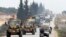 A Turkish military convoy is seen moving through eastern Idlib province, Syria, Feb. 28, 2020, a day after 33 Turkish soldiers were killed in the province in an airstike by Syrian government forces.