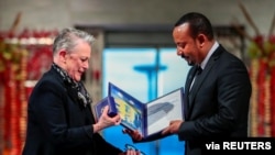 Ethiopian Prime Minister Abiy Ahmed Ali receives medal and diploma from Chair of the Nobel Comitteee Berit Reiss-Andersen during Nobel Peace Prize awarding ceremony in Oslo City Hall, Norway December 10, 2019. NTB Scanpix/Hakon Mosvold Larsen via…