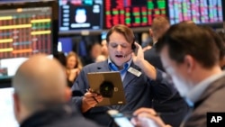 Traders work on the floor at the New York Stock Exchange in New York, Feb. 3, 2025.