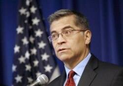 FILE - California Attorney General Xavier Becerra speaks during a news conference in Sacramento, Calif., Dec. 4, 2019.