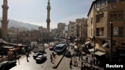 FILE - A general view of the downtown area of the Jordanian capital near the Grand Husseini mosque in Amman, Jan. 21, 2014.