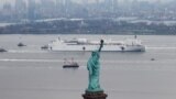 FILE PHOTO: The USNS Comfort passes the Statue of Liberty as it enters New York Harbor during the outbreak of the coronavirus disease (COVID-19) in New York City, U.S., March 30, 2020. REUTERS/Mike Segar/File Photo SEARCH "AMERICA IN THE AGE OF TRUMP" F