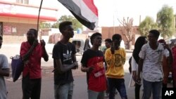 People chant slogans during a protest in Khartoum, amid ongoing demonstrations against a military takeover in Khartoum, Sudan, Nov. 4, 2021.