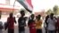 Para warga meneriakan yel-yel dalam sebuah protes di Khartoum, di tengah aksi unjuk rasa menentang kudeta militer yang terjadi Sudan, pada 4 November 2021.