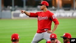 Washington Nationals left fielder Juan Soto warms up during batting practice for baseball's World Series Monday, Oct. 21, 2019, in Houston.