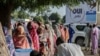 FILE - Women queue to cast their votes during a constitutional referendum at a polling station in N'Djamena, Chad, Dec. 17, 2023. Activists complain that women constitute just over one-third of the candidates in legislative, local and district elections scheduled for next month.
