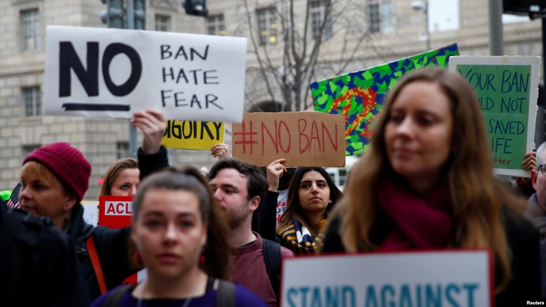Immigration activists rally against the Trump administration's revised ban against travelers from six Muslim-majority nations, outside of the U.S. Customs and Border Protection headquarters in Washington, March 7, 2017.