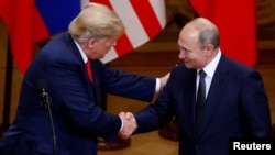 Дональд Трамп и Владимир Путин на переговорах в Финляндии, июль 2018 года