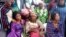 Parents of abducted students from Bethel Baptist High School wait as some are released, in Kaduna, July 25, 2021.