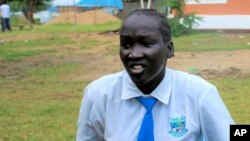 Nyanachiek Madit, 21, who successfully refused when her father told her at age 17 that she would be married off to a man about 50 years old because her family couldn't afford to send her to school, speaks to The Associated Press in Juba, South Sudan on Wednesday, June 8, 2022. 