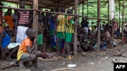 Children displaced by fighting in South Sudan wait to be registered into the Kule 1 and 2 camps for Internally Displaced People at the Pagak border crossing in Gambella, Ethiopia, July 10, 2014.