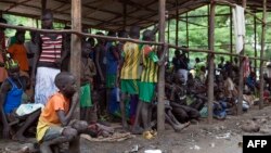 Children displaced by fighting in South Sudan wait to be registered into the Kule 1 and 2 camps for Internally Displaced People at the Pagak border crossing in Gambella, Ethiopia, July 10, 2014.