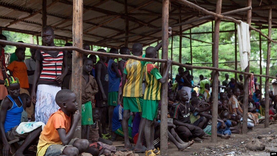 FILE - Children displaced by fighting in South Sudan wait to be registered into the Kule 1 and 2 camps for Internally Displaced People at the Pagak border crossing in Gambella, Ethiopia, July 10, 2014.
