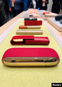IQOS heated tobacco products are seen on display as cigarette maker Philip Morris International launches its first flagship boutique store in Sandton, Johannesburg, South Africa, July 25, 2019.