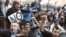 Protesters shout slogans during a demonstration outside Madrid's Parliament, September 26, 2012. 
