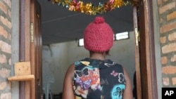 FILE—A 39-year-old security guard stands on the doorway at a clinic in Bangui, Central African Republic, March 11, 2024. She said she was sexually assaulted by a UN peacekeeper in November while on the night shift. Sexual assaults are rising in Central African Republic.