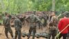 FILE - Trainees take part in military exercises with the Karen National Union (KNU) Brigade 6, an armed rebel group in eastern Karen state on May 9, 2021, amid a heightened conflict with Myanmar's military following the February coup.
