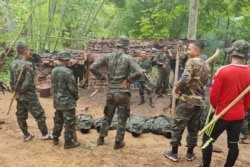 Trainees take part in military exercises with the Karen National Union (KNU) Brigade 6, an armed rebel group in eastern Karen state on May 9, 2021, amid a heightened conflict with Myanmar's military following the February coup.