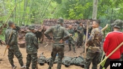 FILE - Trainees take part in military exercises with the Karen National Union (KNU) Brigade 6, an armed rebel group in eastern Karen state on May 9, 2021, amid a heightened conflict with Myanmar's military following the February coup.