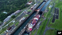 FILE - A cargo ship traverses the Agua Clara Locks of the Panama Canal in Colon, Panama, Sept. 2, 2024.