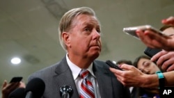 FILE - Sen. Lindsey Graham, speaks to reporters after a briefing on Capitol Hill in Washington, May 21, 2019.