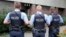 FILE - German police officers guard outside the regional court in Frankfurt, Germany, Sept.15, 2014. 