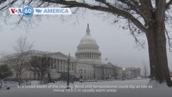 VOA60 America - Bitter cold and snow hit the southern US