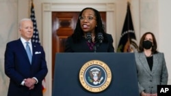 Judge Ketanji Brown Jackson speaks after President Joe Biden announced Jackson as his nominee to the Supreme Court in the Cross Hall of the White House, Feb. 25, 2022, in Washington. Vice President Kamala Harris listens at right. 