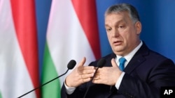 Hungarian Prime Minister Viktor Orban addresses the media during a press conference in the Cabinet Office of the Prime Minister in Budapest, Hungary, Jan. 10, 2019.