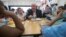 Agriculture Secretary Sonny Perdue eats lunch with students at the Catoctin Elementary School in Leesburg, Virginia, May 1, 2017. Perdue unveiled a new rule on school lunches as the Trump administration and other Republicans press for flexibility after eight years of the emphasis on healthy eating. 