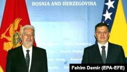 BOSNIA-HERZEGOVINA -- Chairman of the Council of Ministers of Bosnia and Herzegovina, Zoran Tegeltija (R) and Montenegrin Prime Minister Zdravko Krivokapic pose for a photograph before their meeting in Sarajevo, May 24, 2021