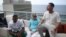 (L-R) Members of the Cuban fusion group Orishas, Yotuel, Roldan and Ruzzo, give an interview from the top of a building in Havana, Cuba, June 22, 2016. 
