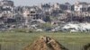 2024年3月26日從以色列南部邊境看到的加沙被摧毀的建築物。