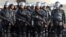 Anti-riot policemen hold rifles during security preparations ahead of Friday's planned protest by hard-line Muslim groups in Jakarta, Indonesia, Nov. 2, 2016.