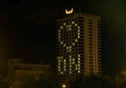 The windows light up the Muong Thanh Hotel in Da Nang, Aug, 17, 2020. (Hugh Bohane/VOA)