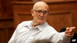 FILE - Convicted killer Edgar Ray Killen points to a family member during a recess in a hearing in Philadelphia, Mississippi, Sept. 9, 2005. 