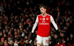 FILE - Arsenal's Mesut Ozil is seen at an Arsenal v Manchester City match, at Emirates Stadium, London, Britain, Dec. 15, 2019.
