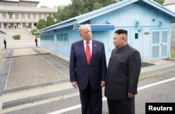 U.S. President Donald Trump meets with North Korean leader Kim Jong Un at the demilitarized zone separating the two Koreas, in Panmunjom, South Korea, June 30, 2019.