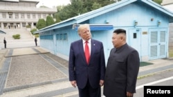 U.S. President Donald Trump meets with North Korean leader Kim Jong Un at the demilitarized zone separating the two Koreas, in Panmunjom, South Korea, June 30, 2019.