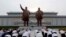 Pyongyang citizens visit Mansu Hill to pay homage to the bronze statues of President Kim Il Sung and Chairman Kim Jong Il ahead of the 27th anniversary of the death of President Kim Il Sung, in Pyongyang, North Korea, on July 7, 2021. 