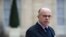 FILE - Then-French Interior minister Bernard Cazeneuve gives a press conference at the Elysee Palace.