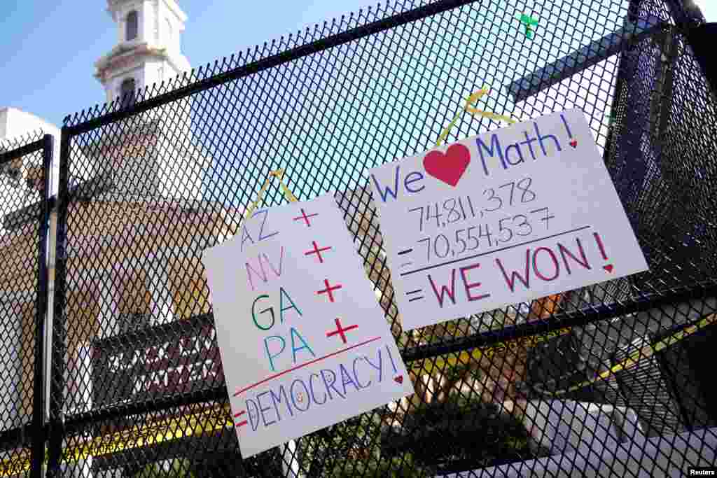 Posters displaying election results hang on the fence outside of St. John&#39;s Church near the White House in Washington, D.C., after a presidential election victory was called for former Vice President Joe Biden.