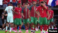 تیم ملی فوتبال مراکش که پس از شکست در برابر فرانسه از جام جهانی کنار رفت.