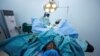 FILE - Doctors perform a fistula repair surgery on a patient in Maiduguri, Nigeria, July 31, 2018. Tuesday is the International Day to End Obstetric Fistula.