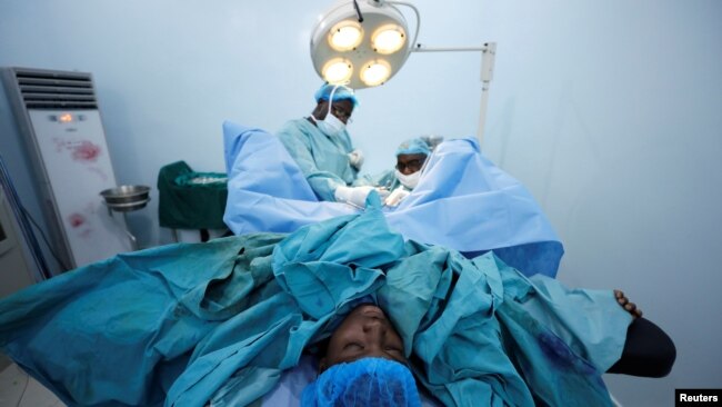 FILE - Doctors perform a fistula repair surgery on a patient in Maiduguri, Nigeria, July 31, 2018. Tuesday is the International Day to End Obstetric Fistula.