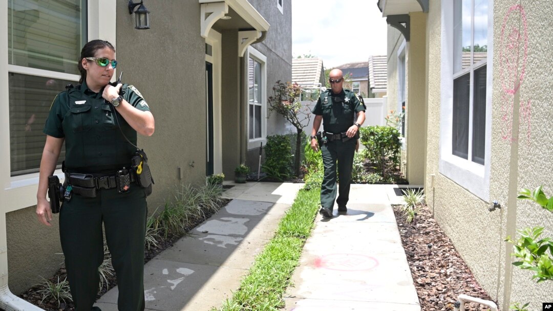 Orange County Sheriff's deputies check on a townhouse owned by Minneapolis police officer Derek Chauvin, May 29, 2020, in Windermere, Fla. 