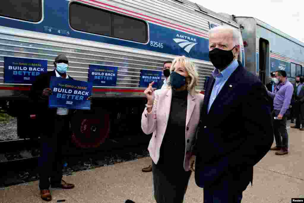 U.S. Democratic presidential candidate and former Vice President Joe Biden and his wife Jill greet supporters as they prepare to board an Amtrak train to begin a campaign train tour in Cleveland, Ohio, Sept. 30, 2020.