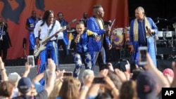 Earth, Wind & Fire members perform on the Acura Stage at the New Orleans Jazz & Heritage Festival in New Orleans, April 25, 2019. 